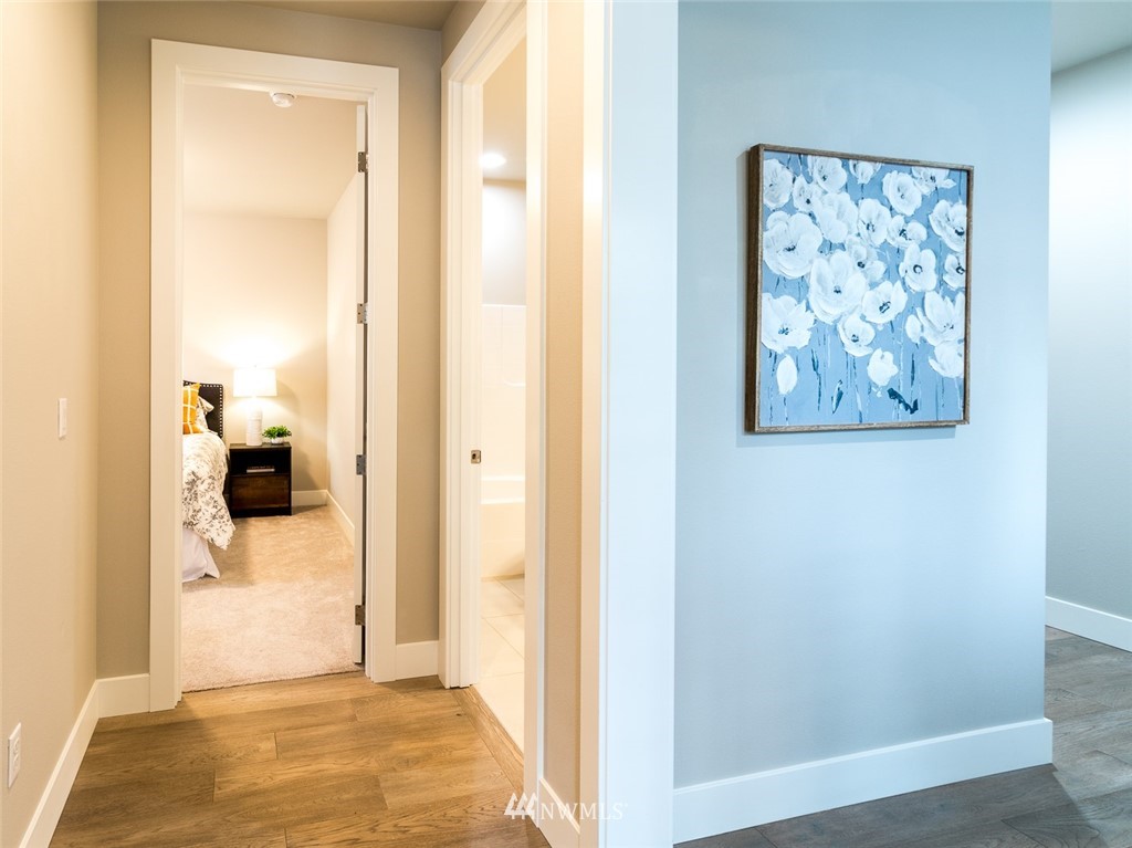 7155 Teal Loop Gig Harbor, WA 98335 - Photo 15 of 40 a view of a bedroom from a hallway