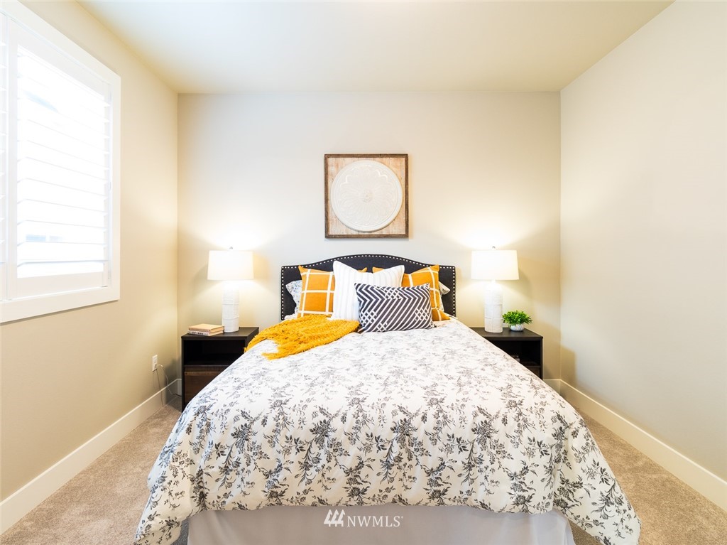 7155 Teal Loop Gig Harbor, WA 98335 - Photo 16 of 40 a bedroom with a bed and window