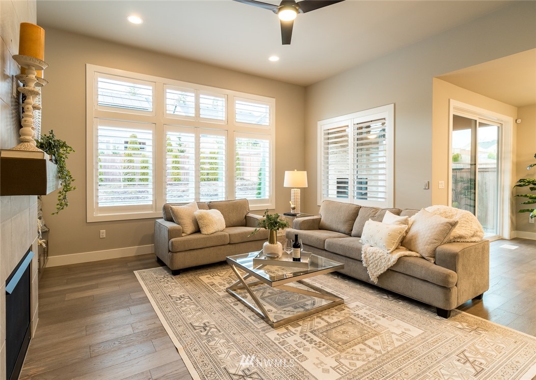 7155 Teal Loop Gig Harbor, WA 98335 - Photo 18 of 40 a living room with furniture and a large window