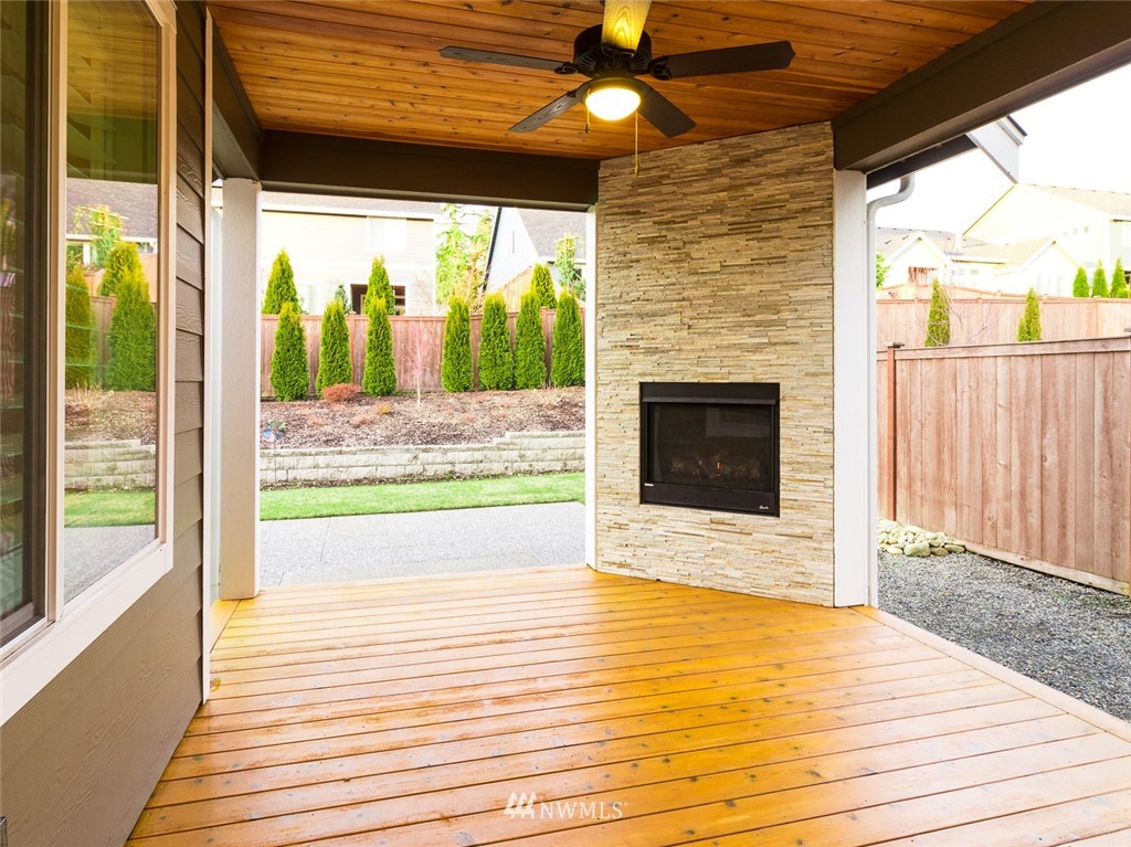 7155 Teal Loop Gig Harbor, WA 98335 - Photo 24 of 40 a view of front door and porch with wooden floor