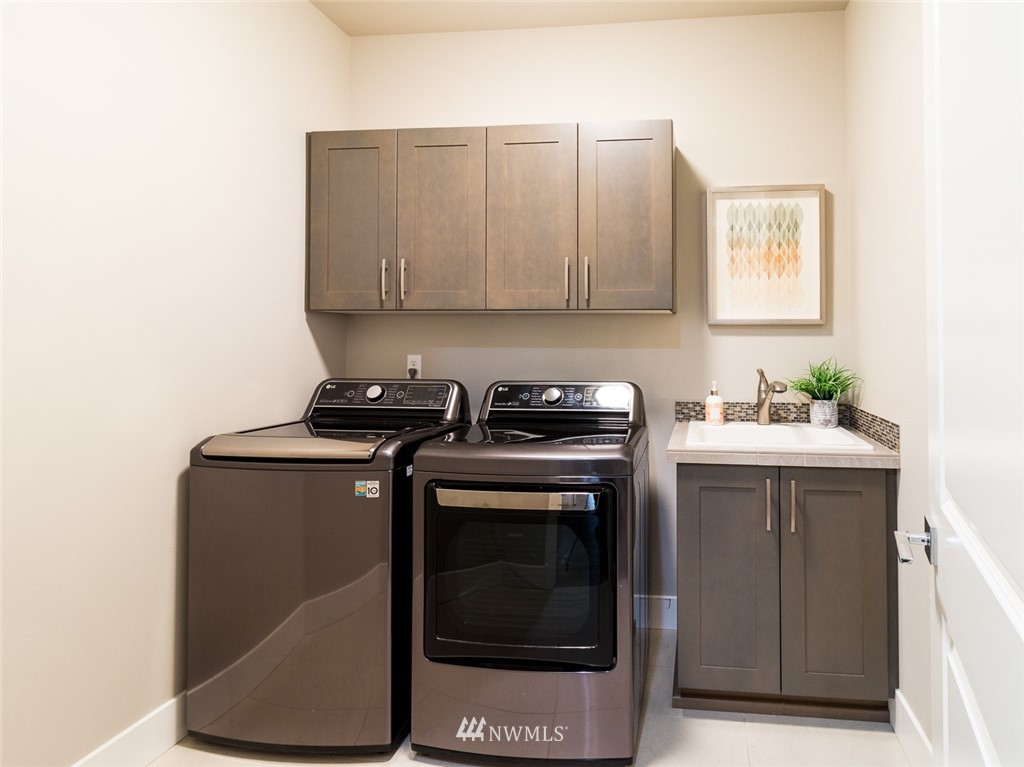 7155 Teal Loop Gig Harbor, WA 98335 - Photo 30 of 40 a kitchen with a stove and a microwave