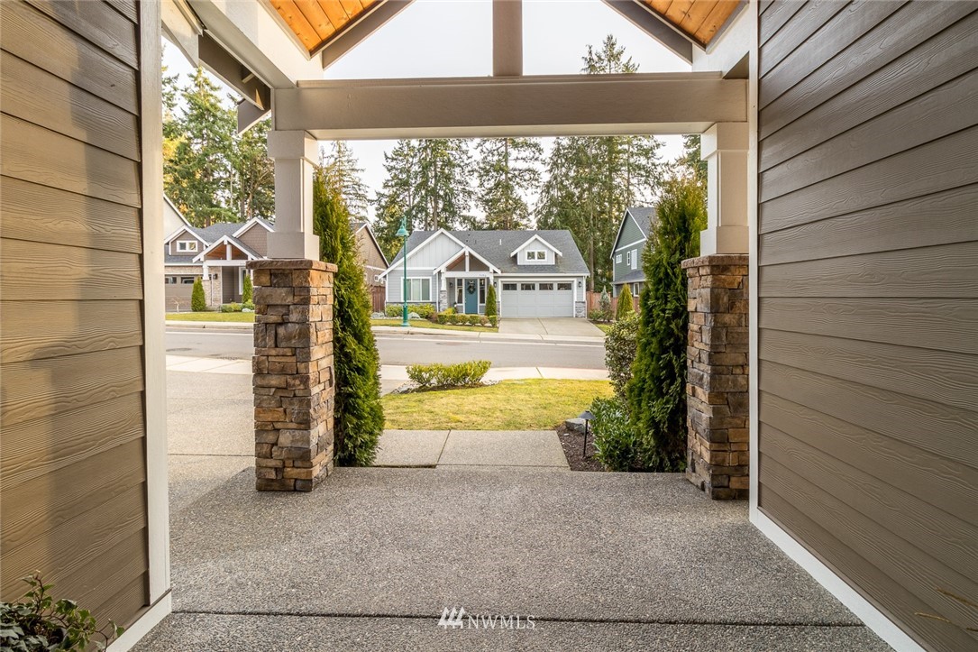 7155 Teal Loop Gig Harbor, WA 98335 - Photo 38 of 40 a view of a house with a yard