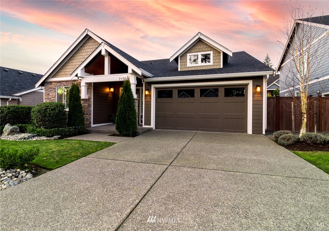 7155 Teal Loop Gig Harbor, WA 98335 - Photo 40 of 40 a front view of a house with a yard