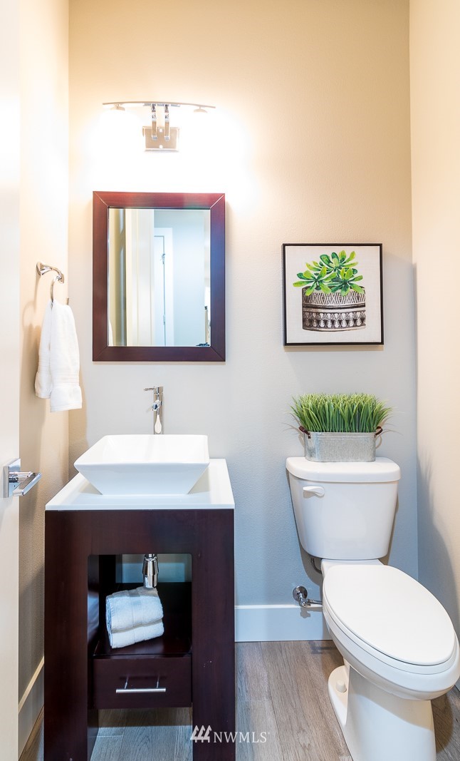 7155 Teal Loop Gig Harbor, WA 98335 - Photo 9 of 40 a bathroom with a toilet a sink and mirror