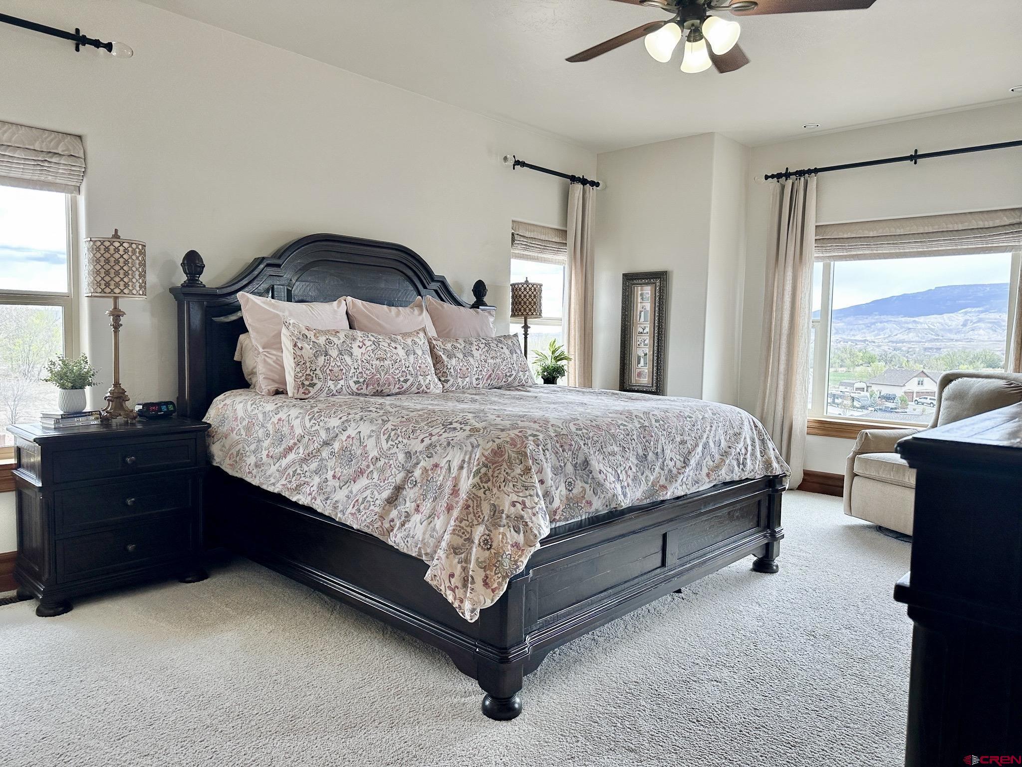 1787 Roubideau Street Delta, CO 81416 - Photo 19 of 35 a bedroom with a bed and a large window