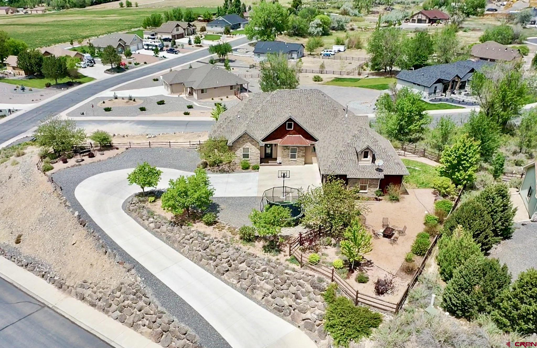 1787 Roubideau Street Delta, CO 81416 - Photo 2 of 35 an aerial view of a house with a garden and lake view