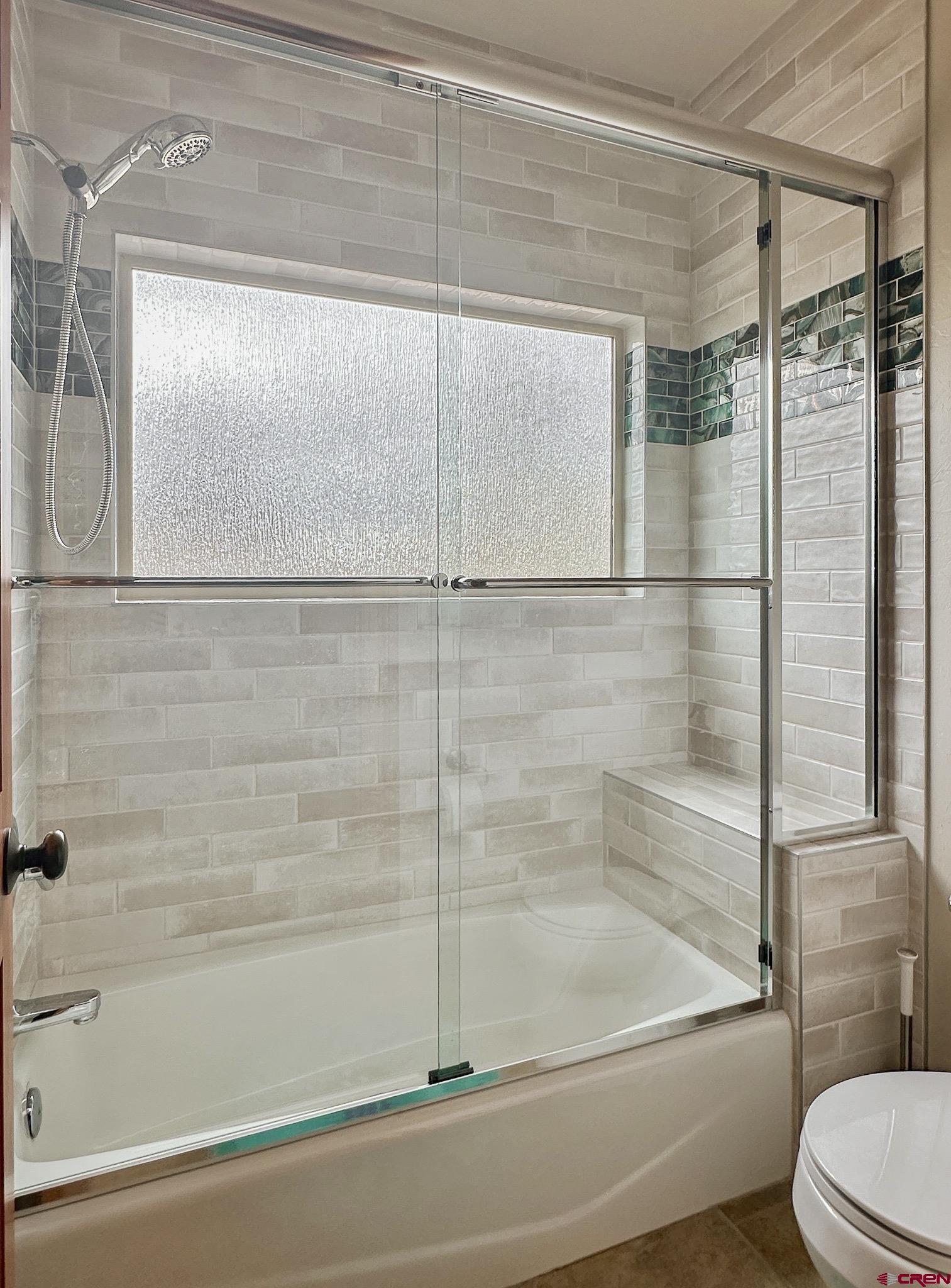 1787 Roubideau Street Delta, CO 81416 - Photo 30 of 35 a bathroom with a bathtub and a shower
