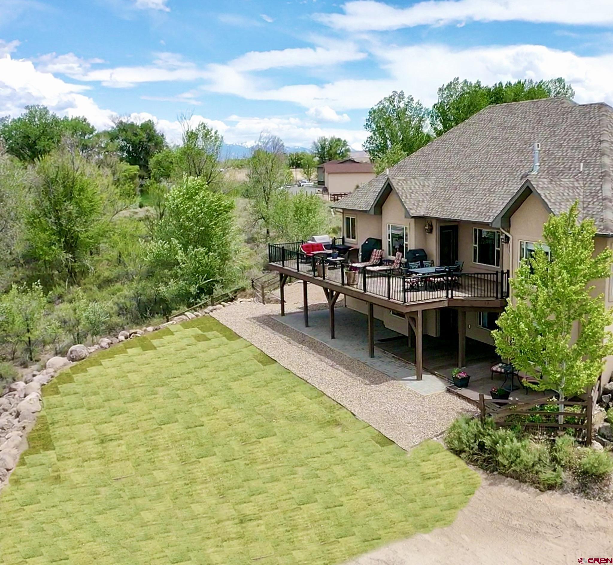 1787 Roubideau Street Delta, CO 81416 - Photo 3 of 35 a view of a patio with table and chairs and potted plants
