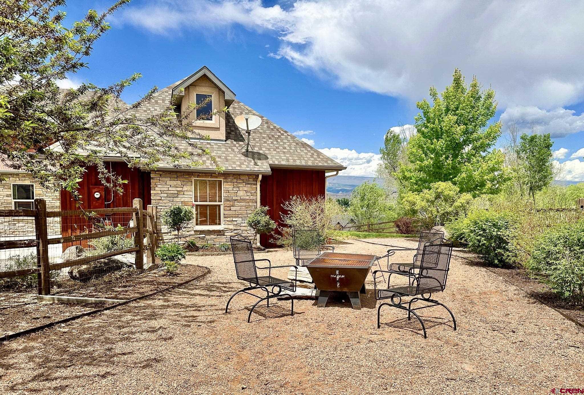 1787 Roubideau Street Delta, CO 81416 - Photo 34 of 35 a view of a dinning table and chairs in the patio