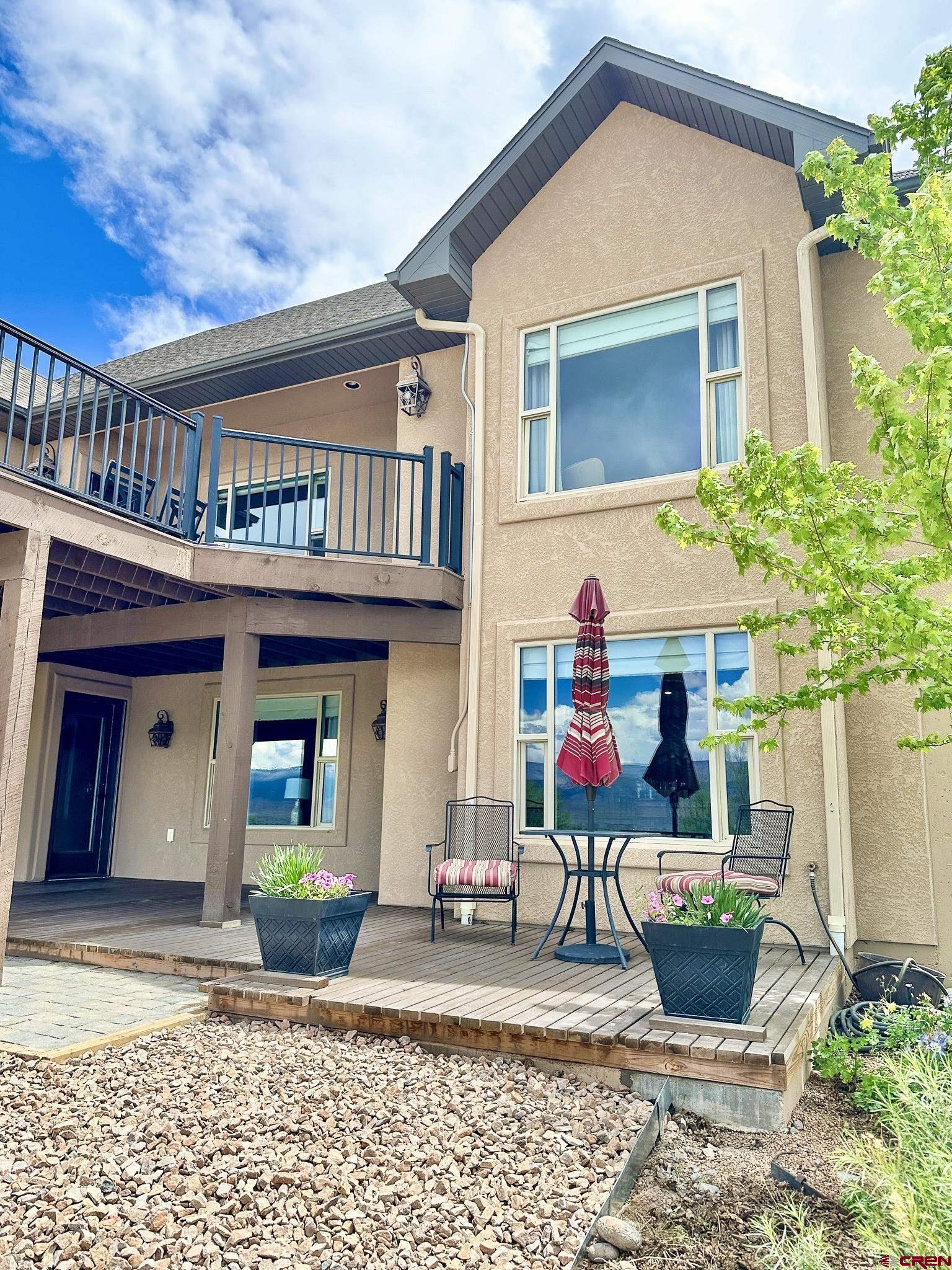 1787 Roubideau Street Delta, CO 81416 - Photo 6 of 35 a front view of a house with garden