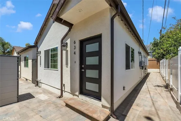 a view of a house with wooden floor and stairs