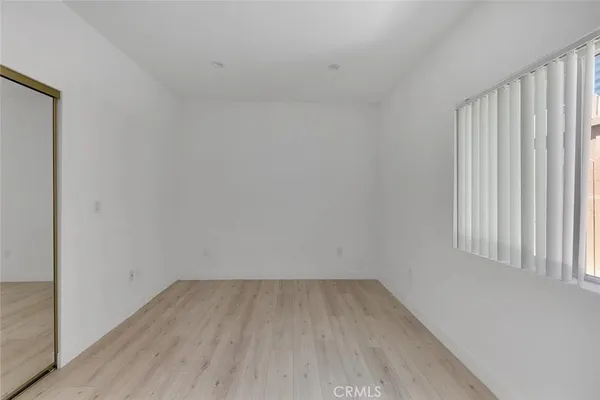 a view of a room that has wooden floor