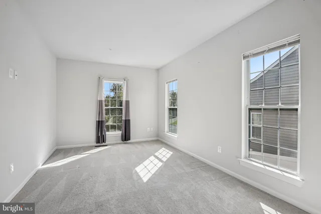 a bedroom with furniture and a fireplace