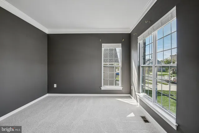 a bedroom with a bed and a potted plant