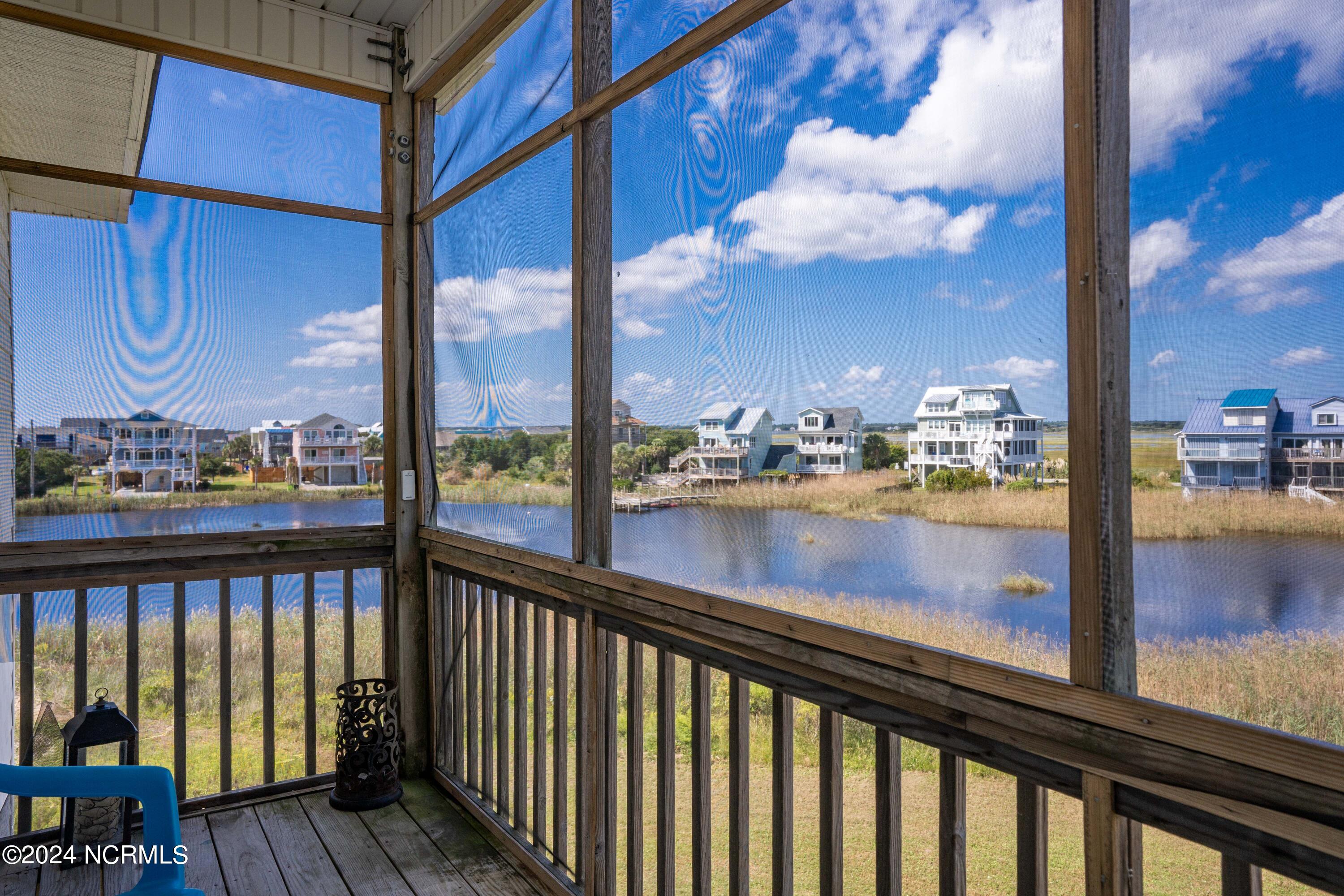 2385 New River Inlet Road North Topsail Beach, NC 28460 - Photo 11 of 43 Screened porch with pond and River view