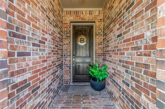 a view of a house with a potted plant