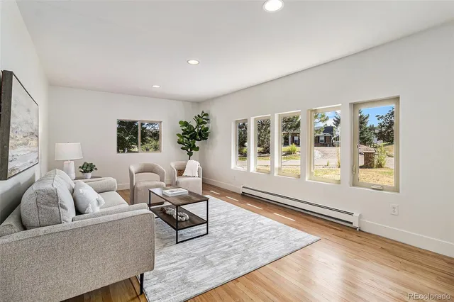 a living room with furniture and windows