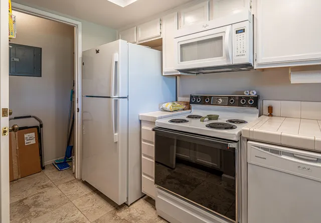 a kitchen with a stove microwave and refrigerator