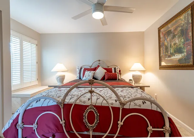 a bedroom with a bed and dresser