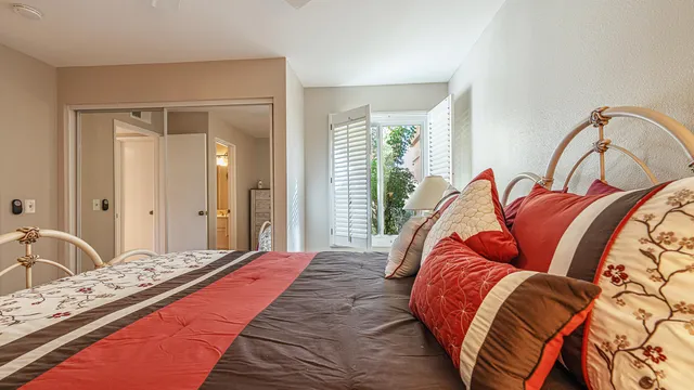 a bedroom with bed and a window