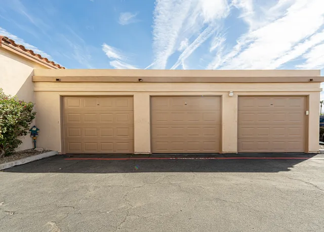 a view of house with garage