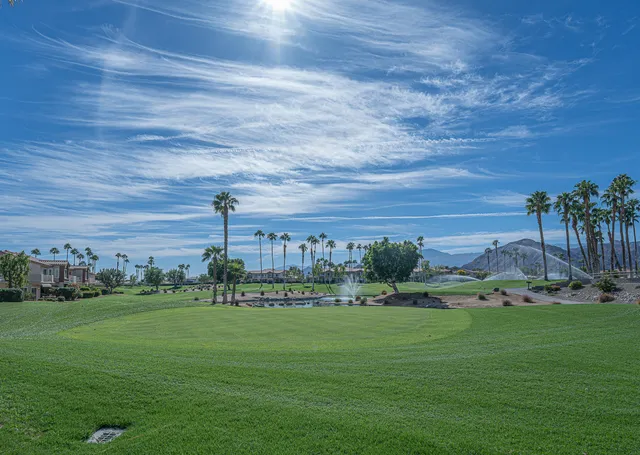 a view of a golf course with a big yard
