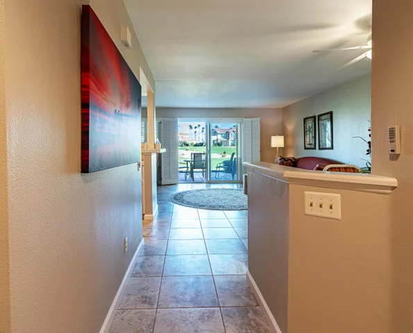 a kitchen with kitchen island a counter top space and a stove top oven