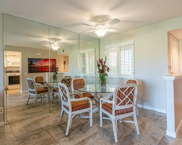 a dining room with furniture and window