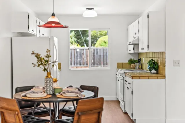 a view of a dining room with furniture window and outside view