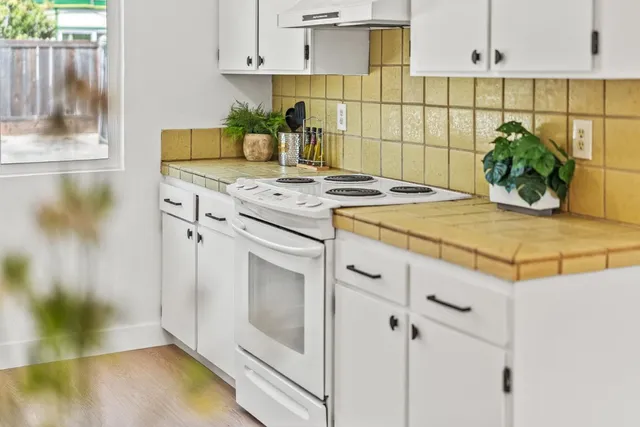 a kitchen with a sink and cabinets