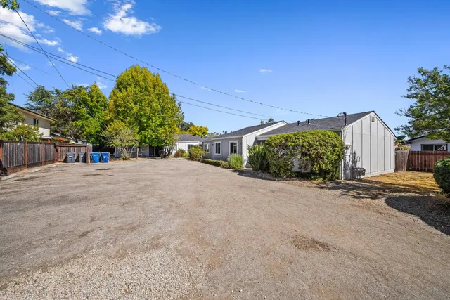 a view of a road with a building in the background