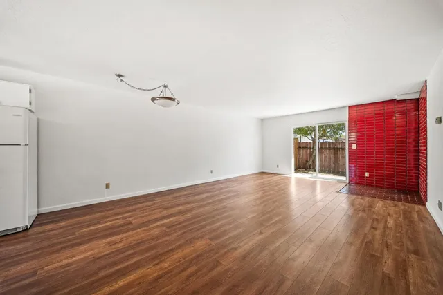 a view of a livingroom with wooden floor