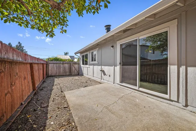 a view of a house with a backyard and stairs