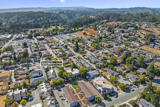 an aerial view of residential building with parking space