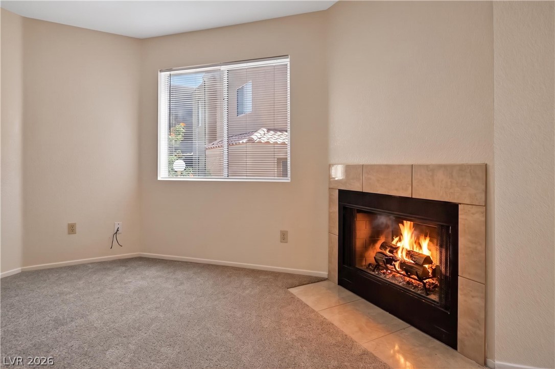 2241 Highpointe Drive, Unit 101 Laughlin, NV 89029 - Photo 4 of 23 Warm and inviting living space with a charming fireplace and ample natural light.