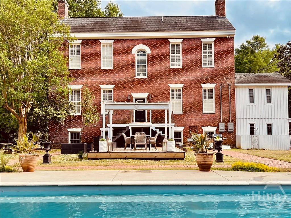 Back of the house with saltwater pool