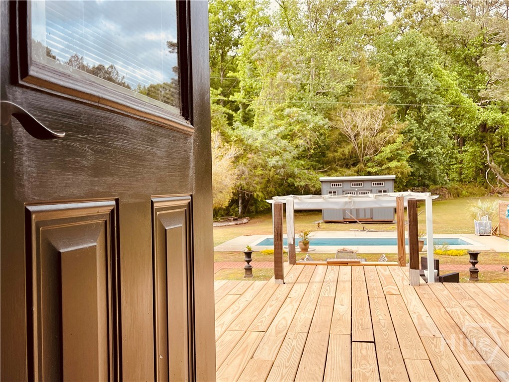 837 Bartram Trace Road Rayle, GA 30660 - Photo 48 of 70 Back door leading out to the deck and pool