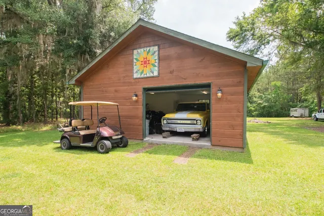 a view of house with yard and entertaining space