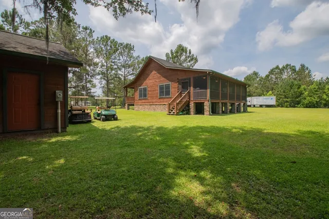a front view of house with yard and green space