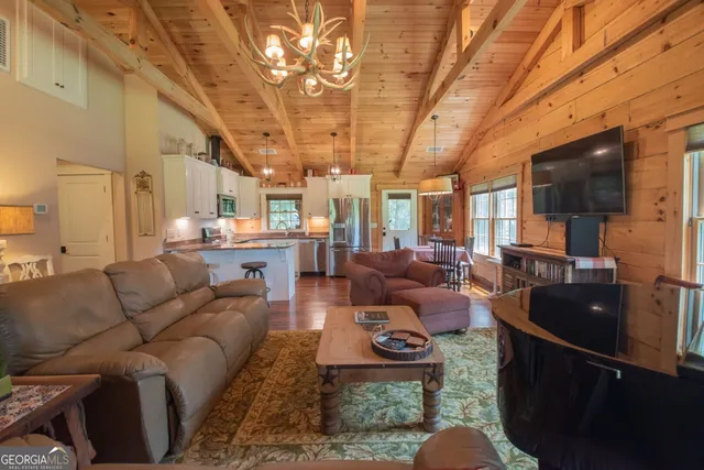 a living room with furniture wooden floor and a table