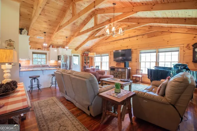 a kitchen with stainless steel appliances a stove sink microwave and refrigerator