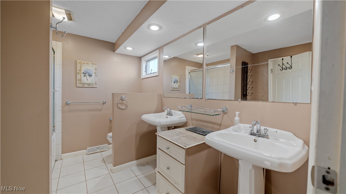 546 Twitchell Road Mansfield, OH 44903 - Photo 25 of 47 Bathroom featuring shower / tub combination, tile patterned flooring, and toilet