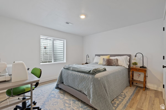 1323 South Raintree Lane Santaquin, UT 84655 - Photo 15 of 23 Bedroom featuring light wood-type flooring and a desk
