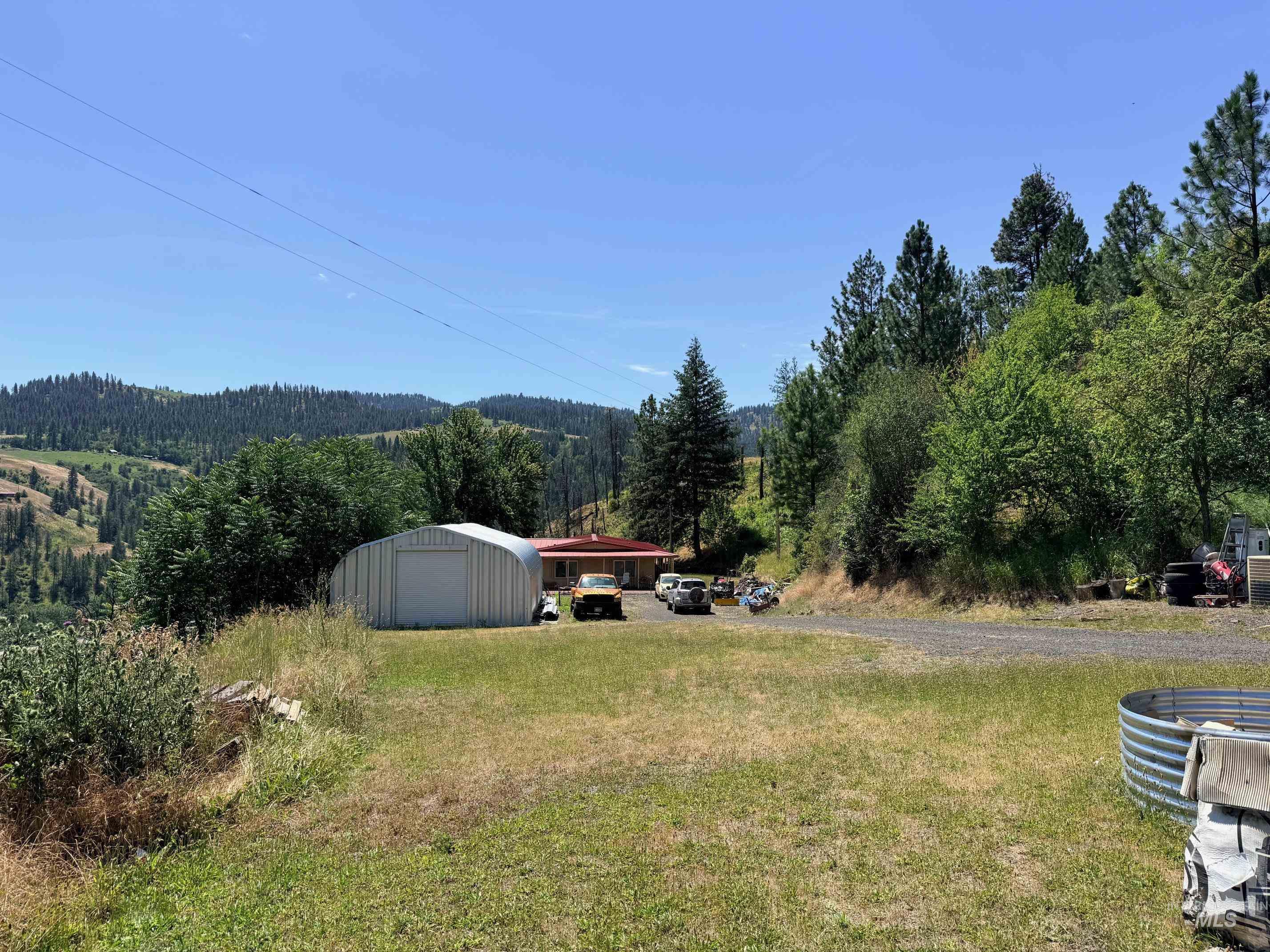 35322 River Road Lenore, ID 83541 - Photo 27 of 42 Single-story residence featuring a red roof and an attached garage