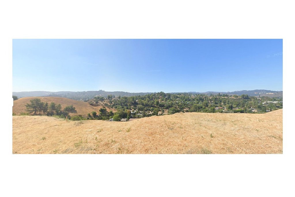 22552 Uhea Road Woodland Hills, CA 91364 - Photo 7 of 8 a view of an outdoor space and mountain view