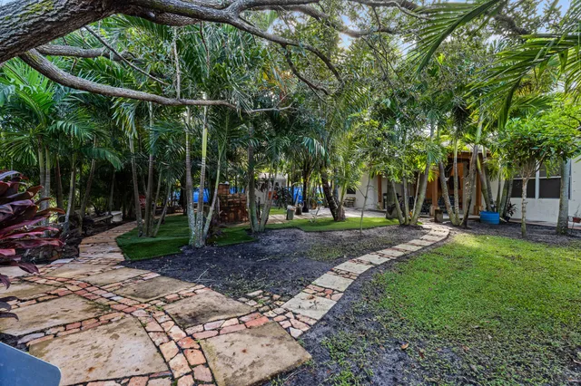 a view of a park with swings and slides