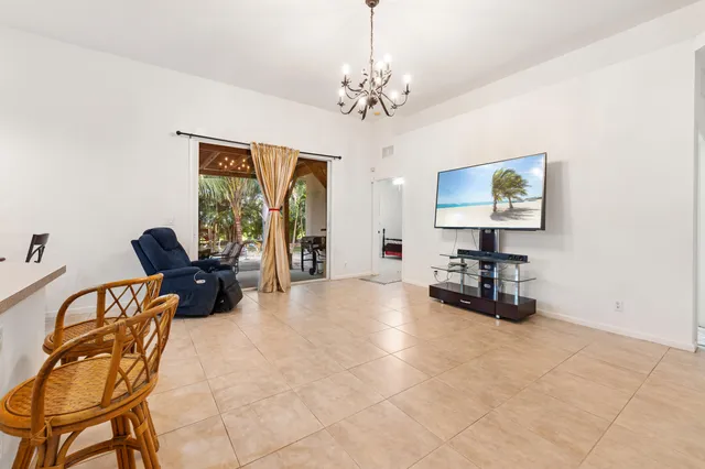 a view of a livingroom with workspace and a couch