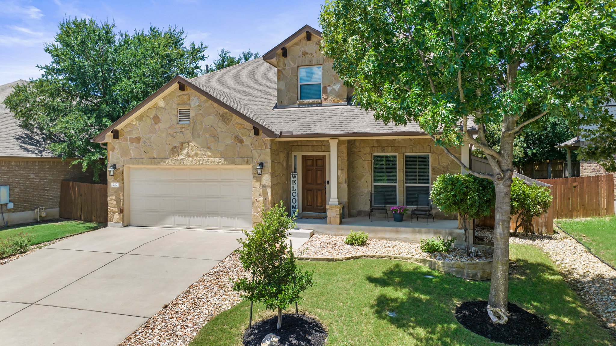 220 San Matteo Street Georgetown, TX 78628 - Photo 1 of 1 Stone home with a 2 car garage.