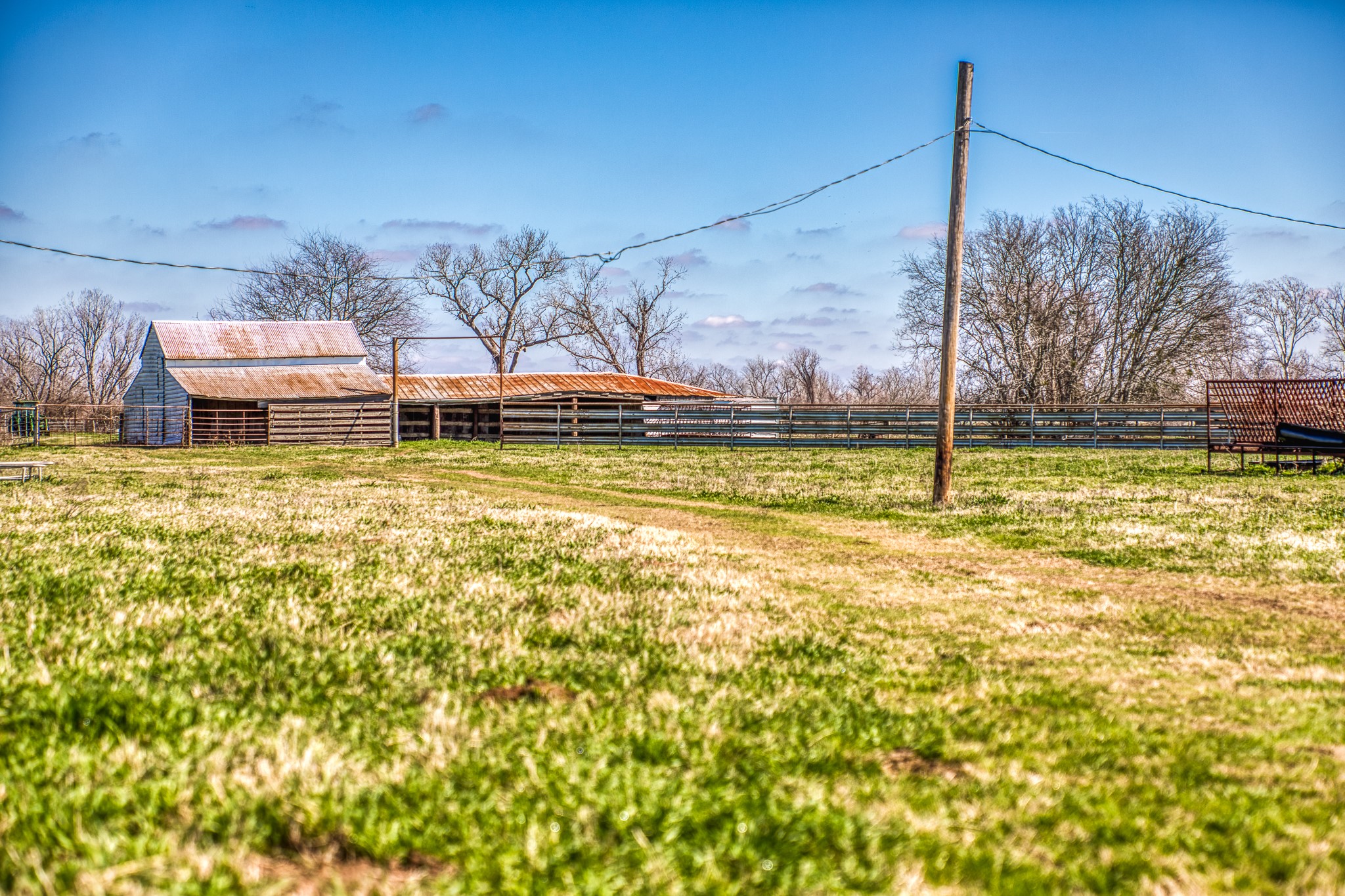 0 Steck Bottom Road Sealy, TX 77474 - Photo 13 of 15 a view of a swimming pool with a lawn chairs under an umbrella
