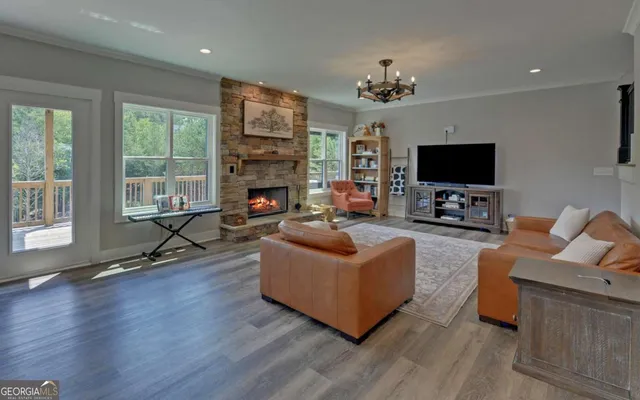 a bathroom with a granite countertop sink toilet a mirror and shower